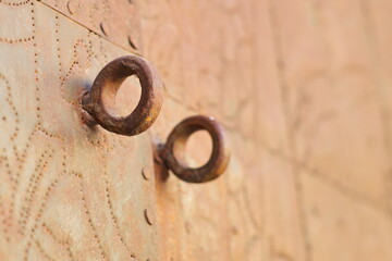 Old rusty iron door to enter a palace