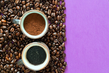 ready coffee cup and ground coffee cup on a coffee beans on a purple background