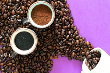 ready coffee cup and ground coffee cup and cup of beans on purple background