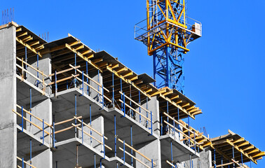 Crane and highrise construction site