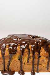 melted chocolate poured over a chocolate chip loaf cake 