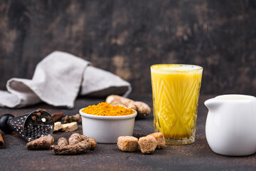 Obraz na płótnie Canvas Turmeric golden milk with spices