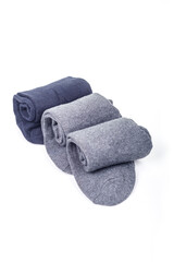 Studio lighting. men's warm socks of different colors, on a white background. Close-up.