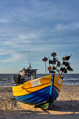 Wooden fishing boat on Baltic Sea beach.