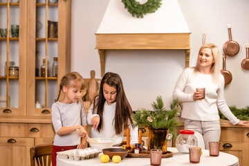 kids baking christmas cookies before the celebration of Christmas. Family