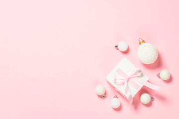 Christmas pink flat lay background with holiday decorations.