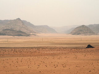 Fototapeta na wymiar Desert landscape with dusty air
