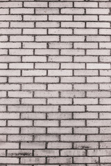 An abstract, old, beige brick wall, can be used as a background