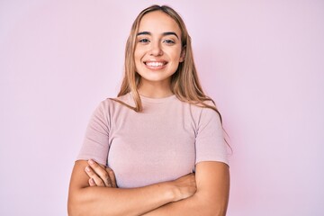 Fototapeta premium Young beautiful blonde woman wearing casual clothes happy face smiling with crossed arms looking at the camera. positive person.