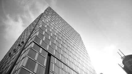 Fototapeta premium Abstract modern architecture with high contrast black and white tone. Architecture of geometry at glass window - monochrome. Black and white.