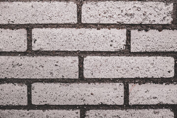 An abstract, old, beige brick wall, can be used as a background