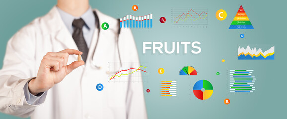 Nutritionist giving you a pill with FRUITS inscription, healthy lifestyle concept