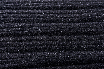 black sand background with waves, close-up