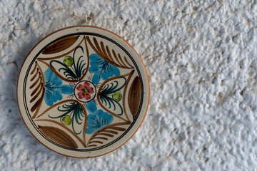 plate decorating the wall hand painted