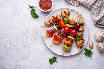 Vegetarian skewers with different grilled vegetables.