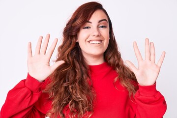 Young beautiful woman wearing casual clothes showing and pointing up with fingers number ten while smiling confident and happy.