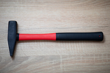 Hammer on the wooden table.