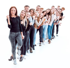 Obraz premium confident young woman standing in front of a column of young people