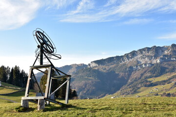 A small ski lift out of service in late autumn on the top of a slope in Amden, a tourist and ski...