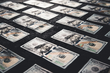 One hundred dollar bills are creatively laid out. Business concept, development perspective.