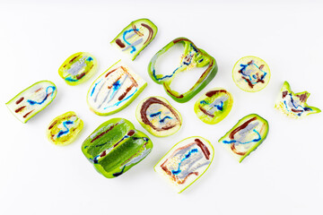 Collection of green vegetables and fruits on a white background. Vegetable pattern of green vegetables. Bell peppers, tomatoes, cucumber, cabbage, zucchini and apple in dyes