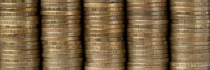 copper coins stacked in piles © guppys