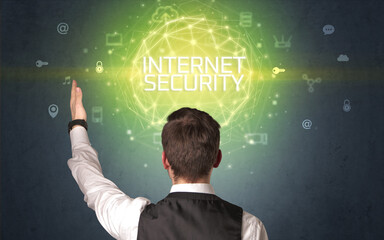 Rear view of a businessman with INTERNET SECURITY inscription, online security concept