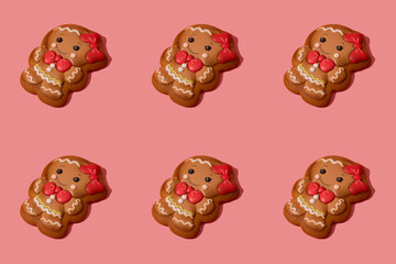 Christmas gingerbread girl on the rose background. Banner