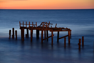 Fototapeta premium Broken pier at after sunset, Unieście, Poland, Baltic sea.