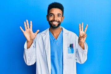 Handsome young hispanic business man wearing doctor uniform afraid and terrified with fear expression stop gesture with hands, shouting in shock. panic concept.