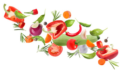 Set of different fresh vegetables and spices falling on white background