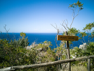 Along the coastal hiking trail of the  Zingaro Natural Reserve in Sicily a sign show the way for 