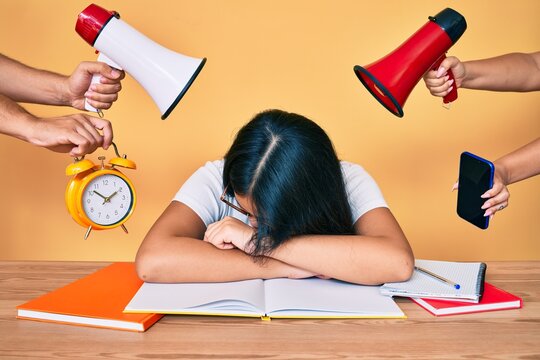 Young asian woman tired of univeristy exam under big pressure for deadline