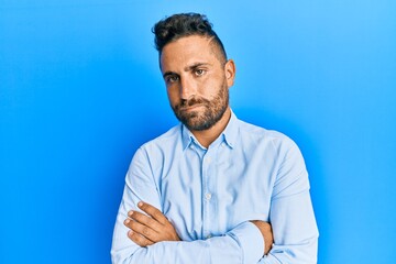 Handsome man with beard wearing casual clothes skeptic and nervous, disapproving expression on face...