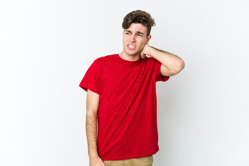 Obraz premium Young caucasian man isolated on white background suffering neck pain due to sedentary lifestyle.