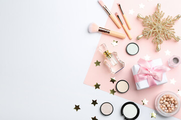 Flat lay composition with decorative cosmetic products on color background, space for text. Winter care