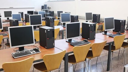 Empty modern multimedia classroom with computers