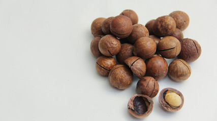 macadamia nuts lie in the form of a heart on a white background