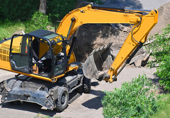 Excavating machine on construction site