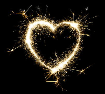 Bright sparkling heart contour on black background