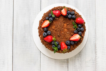Tasty Birthday  honey cakewith fresh berries (strawberries, blueberries).