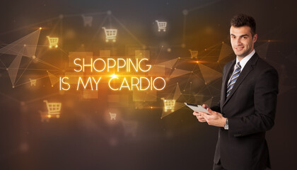 Businessman with shopping cart icons and SHOPPING IS MY CARDIO inscription, online shopping concept