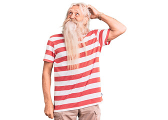 Old senior man with grey hair and long beard wearing striped tshirt confuse and wondering about question. uncertain with doubt, thinking with hand on head. pensive concept.