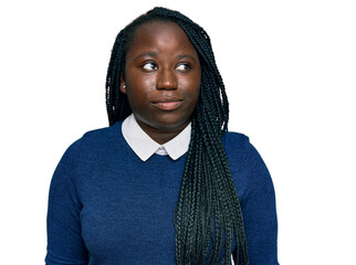 Young black woman with braids wearing casual clothes smiling looking to the side and staring away thinking.