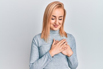 Beautiful caucasian woman wearing casual clothes smiling with hands on chest, eyes closed with grateful gesture on face. health concept.