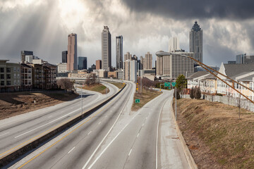 Highway leading to downtown Atlanta, Georgia with storm sky.