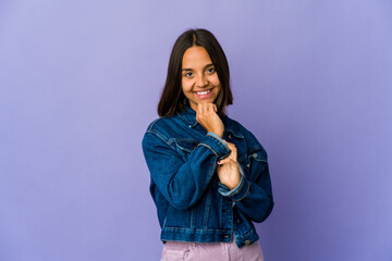 Young mixed race woman smiling happy and confident, touching chin with hand.