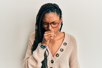 African american woman wearing casual clothes and glasses feeling unwell and coughing as symptom for cold or bronchitis. health care concept.