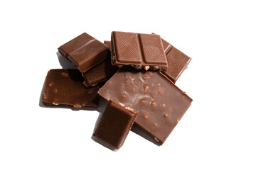 Broken pieces of milk chocolate with nuts on a white background isolate
