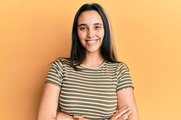 Obraz premium Young hispanic woman wearing casual clothes scared and amazed with open mouth for surprise, disbelief face